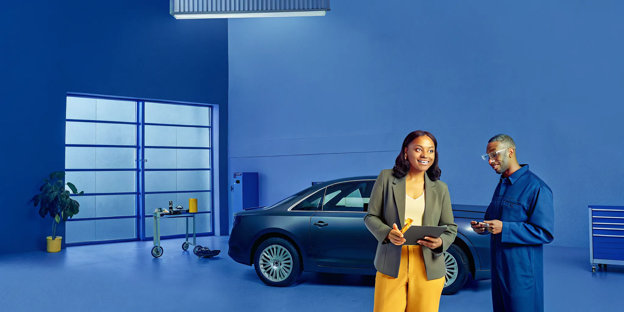A technician and customer discuss car service at A & G Auto Repair & Body Shop.