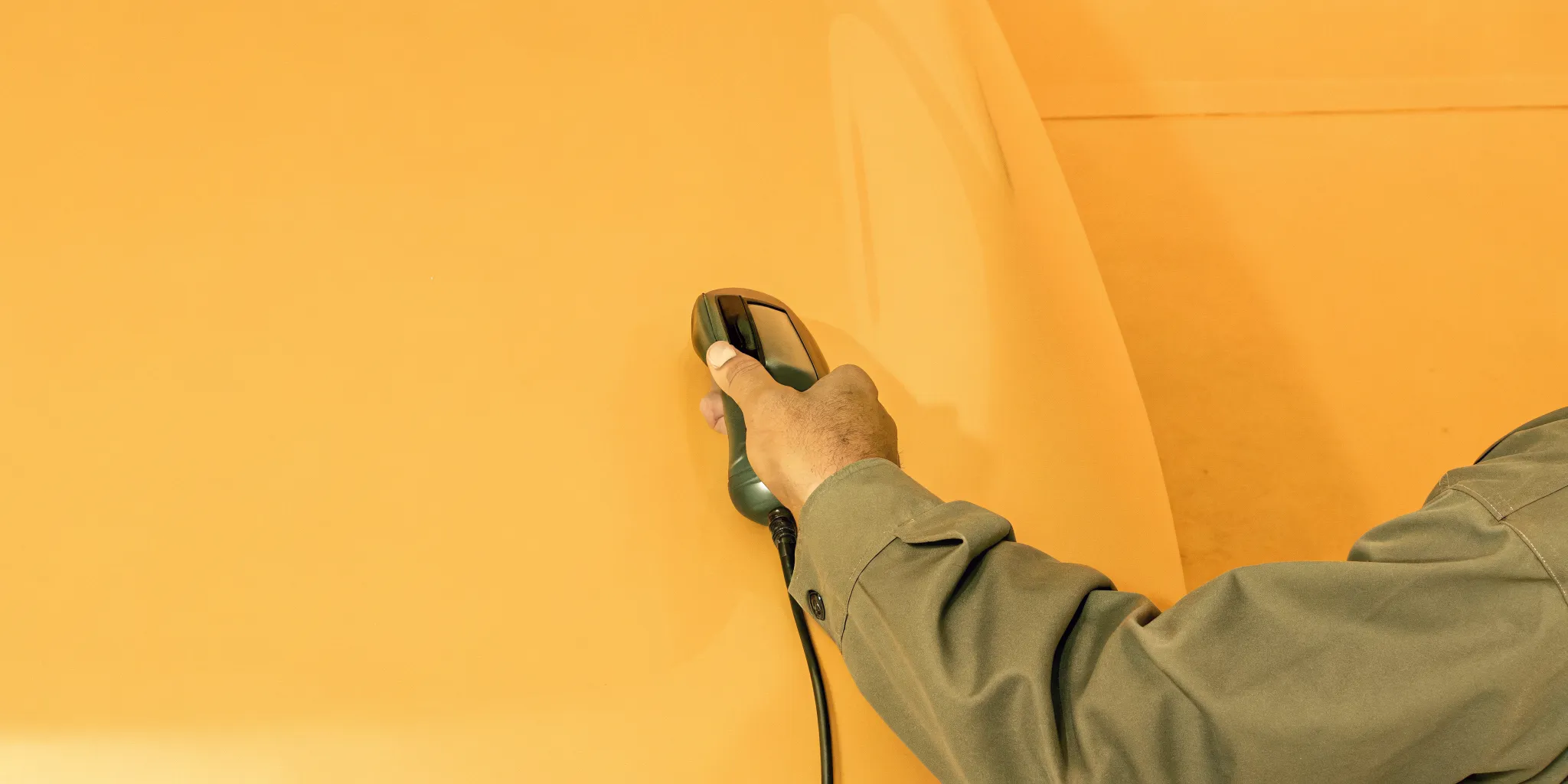 Technician performing computerized auto paint matching