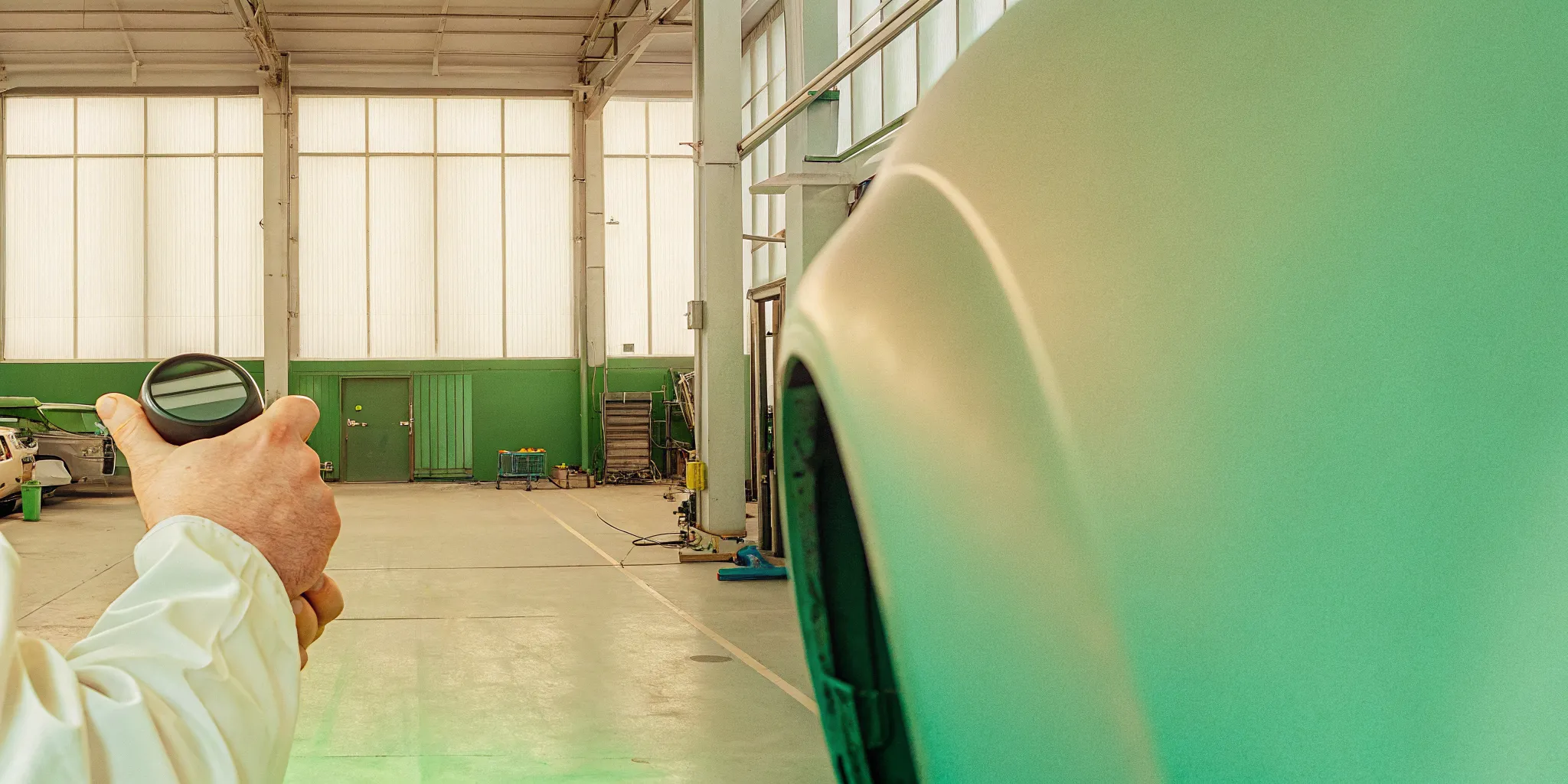 Technician assessing car scratch repair Orlando damage