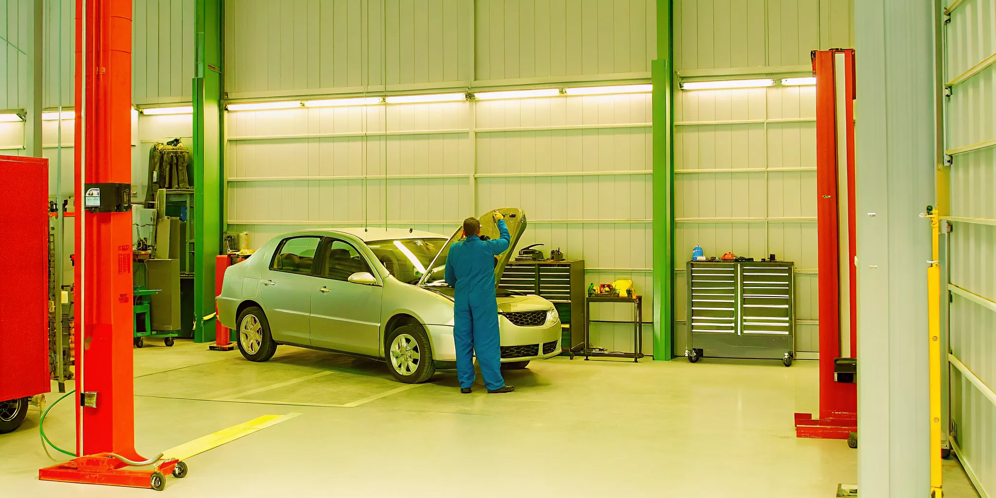 Technician inspecting a vehicle during the collision repair process in Orlando
