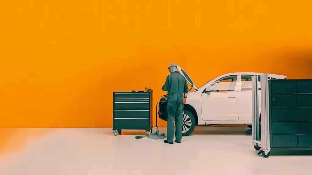 OE certified collision repair technician working on vehicle at Collision Center Orlando