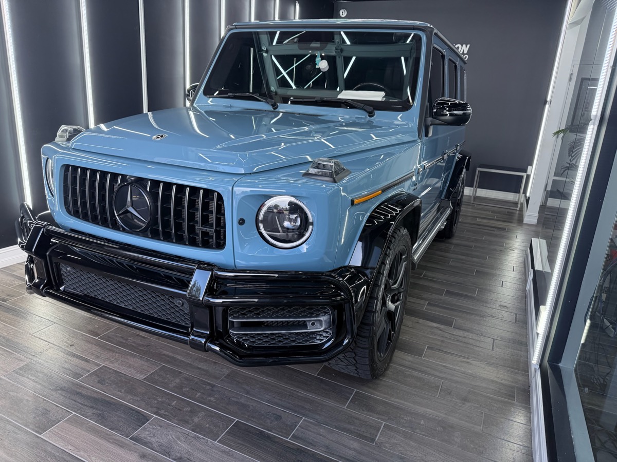 A finished Mercedes-AMG G63 detailed under showroom lighting at Collision Center Orlando A finished Mercedes-AMG G63 detailed under showroom lighting at Collision Center Orlando