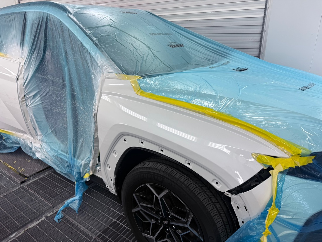 A vehicle masked and prepped in the Collision Center Orlando paint booth for refinishing A vehicle masked and prepped in the Collision Center Orlando paint booth for refinishing