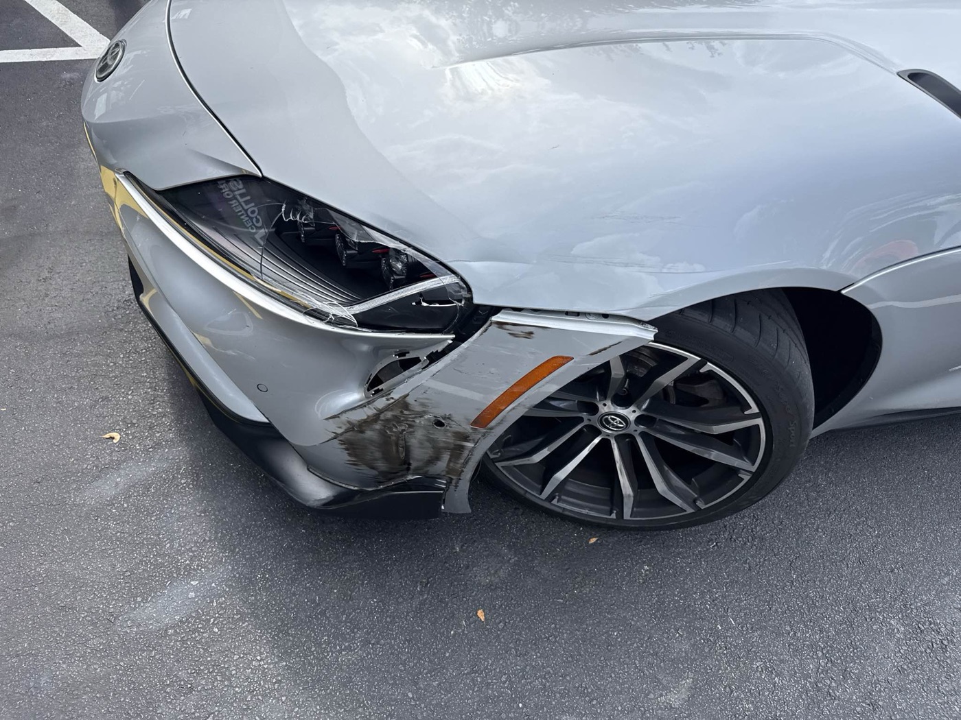 Structural front-end collision damage at intake before frame repair at Collision Center Orlando